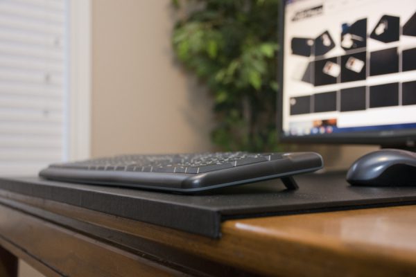 Desk pad with edge protector